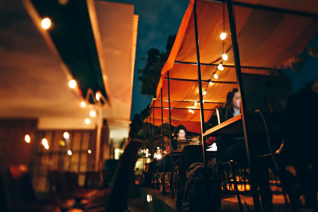 Warm lights of a café terrace at night
